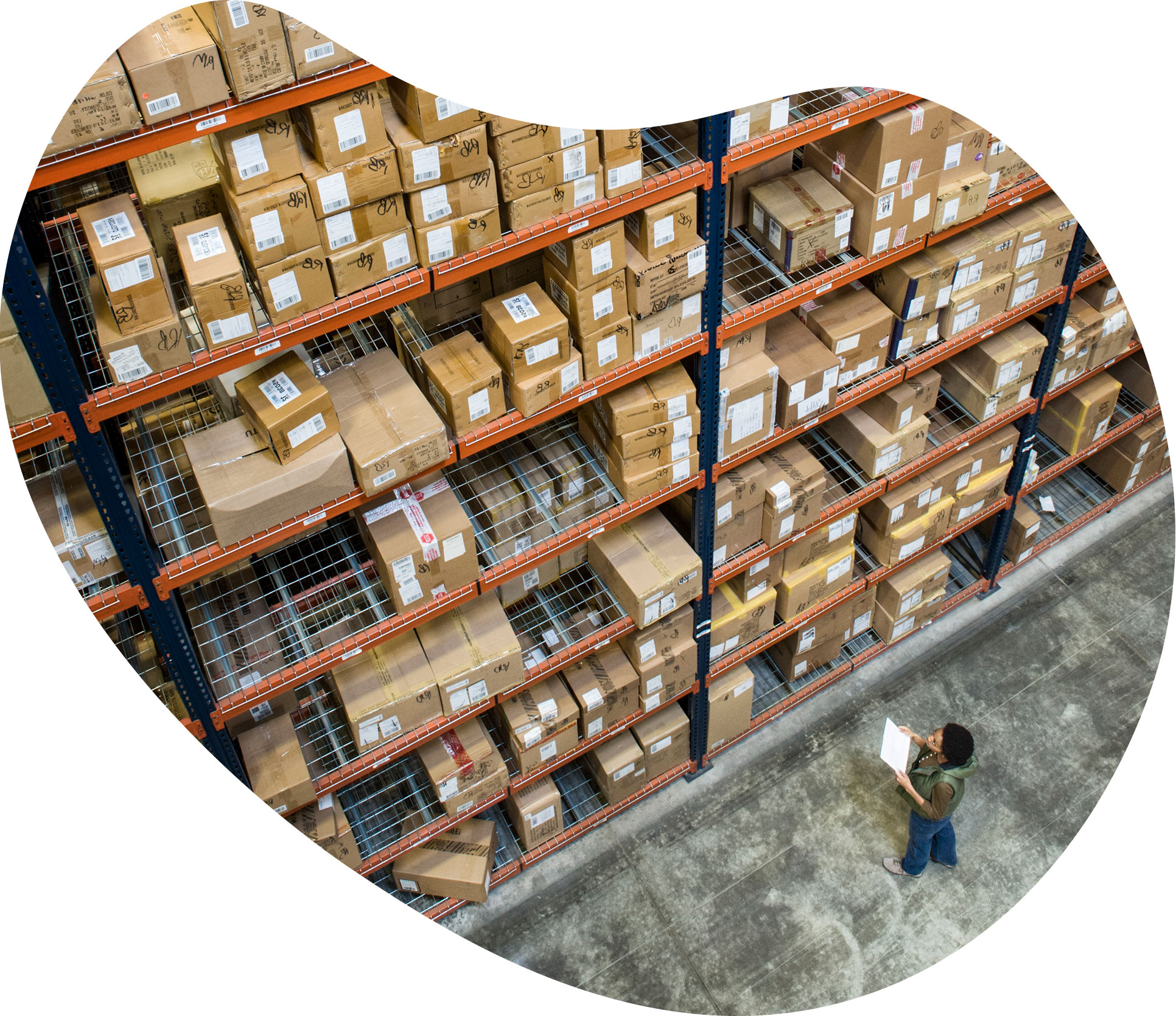 Worker picking products in a large warehouse